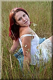 Cute redhead girl in the grass from Bunniesclub