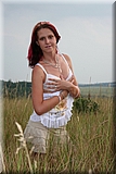 Cute redhead girl in the grass from Bunniesclub
